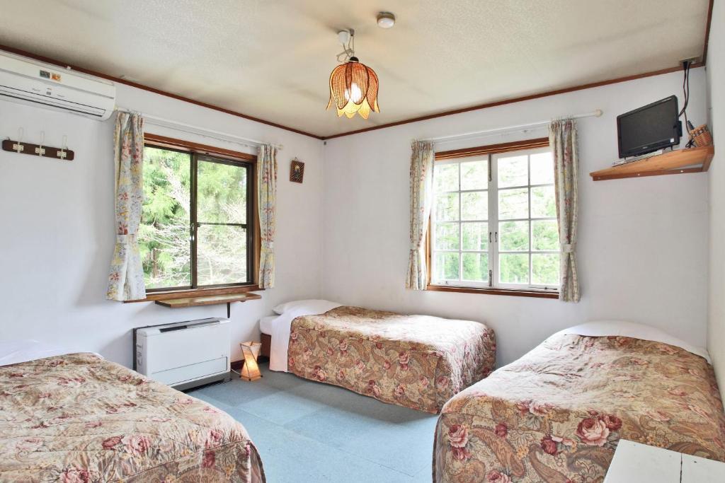Bed and Breakfast ペンション ちゃうちゃう Хакуба-Мура Номер фото