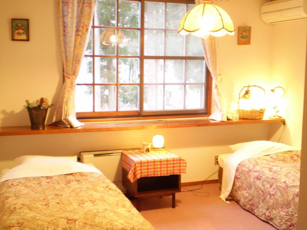 Bed and Breakfast ペンション ちゃうちゃう Хакуба-Мура Номер фото